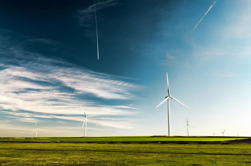 Photo by Arteum.ro photo of wind turbines on green grass